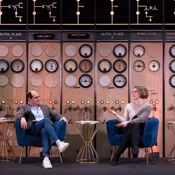 António Simões and Laura Mason on stage at L&G's senior leader event at Battersea Power Station, London, England.
