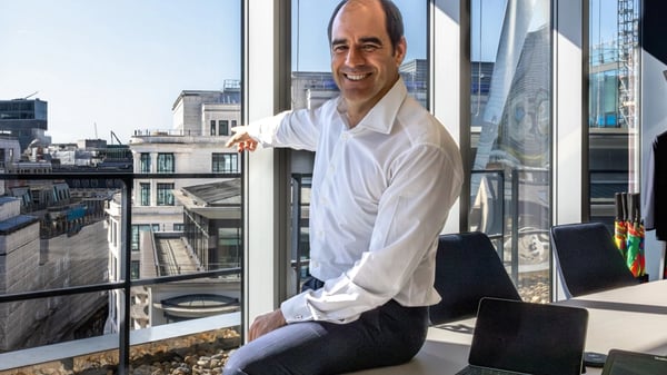 From One Coleman Street, CEO António Simões points outside a large window towards Legal & General's new HQ at Woolgate.