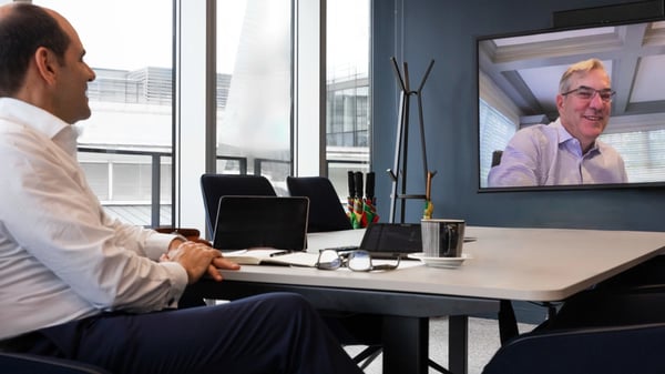 António Simões speaking with Peter Merrigan, CEO of Taurus Investment Holdings, over video call.