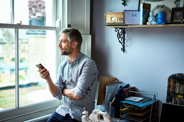 Man Seated By A Window