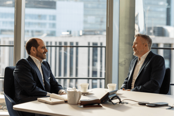 Jamie Ovenden and António Simões seated at a meeting table in L&G's London office.