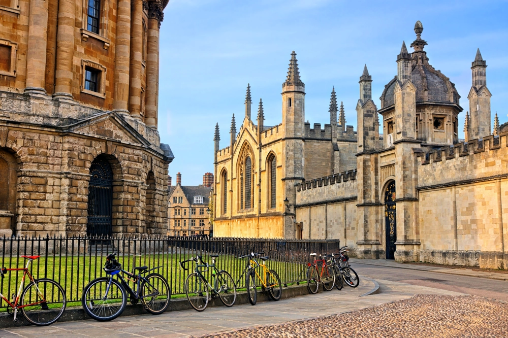 The Radcliffe Camera in Oxford, UK, at dusk with no people around, on a clear day with blue sky. The Radcliffe Camera in Oxford, UK, at dusk with no people around, on a clear day with blue sky.