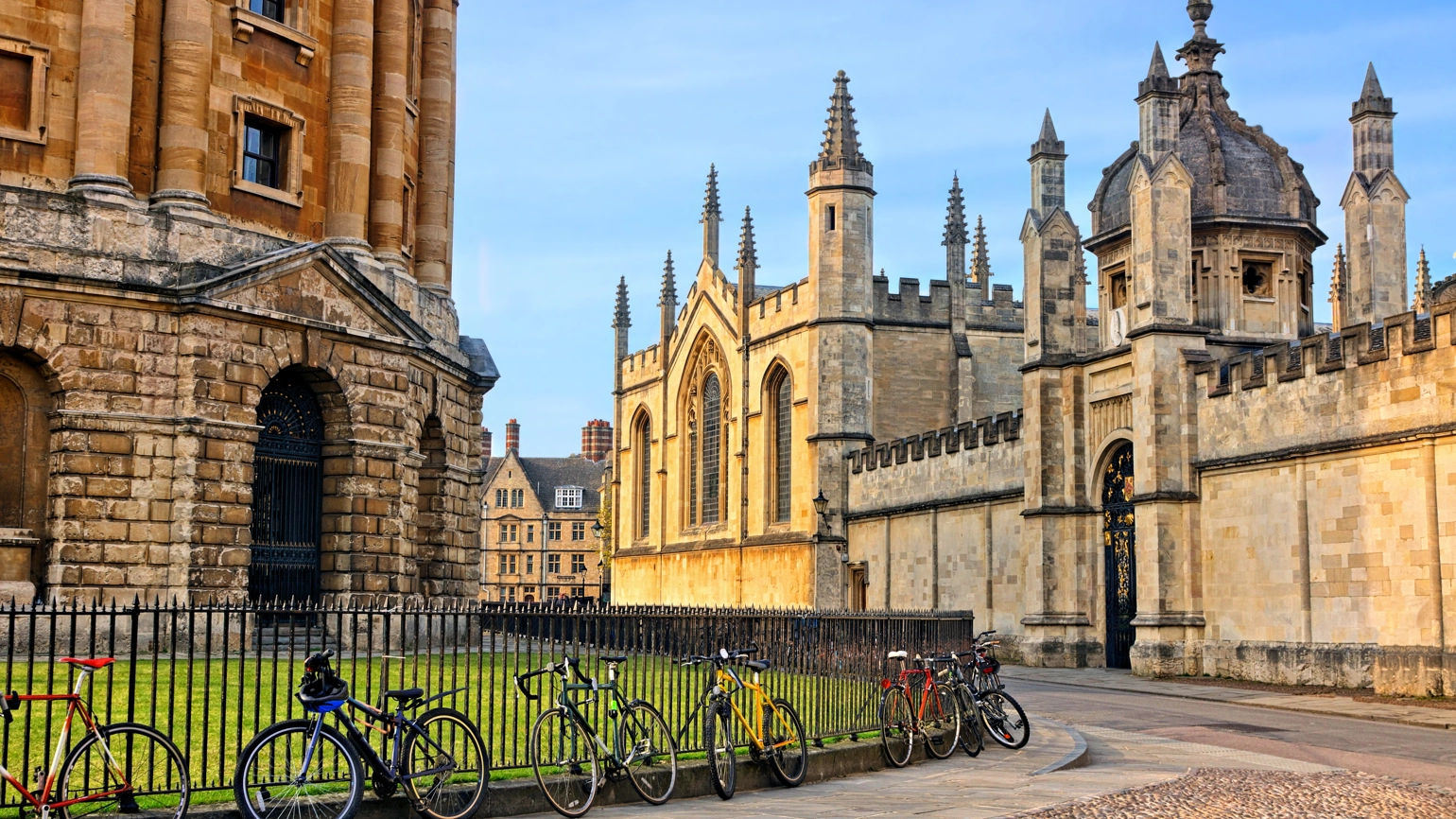 The Radcliffe Camera in Oxford, UK, at dusk with no people around, on a clear day with blue sky. The Radcliffe Camera in Oxford, UK, at dusk with no people around, on a clear day with blue sky.