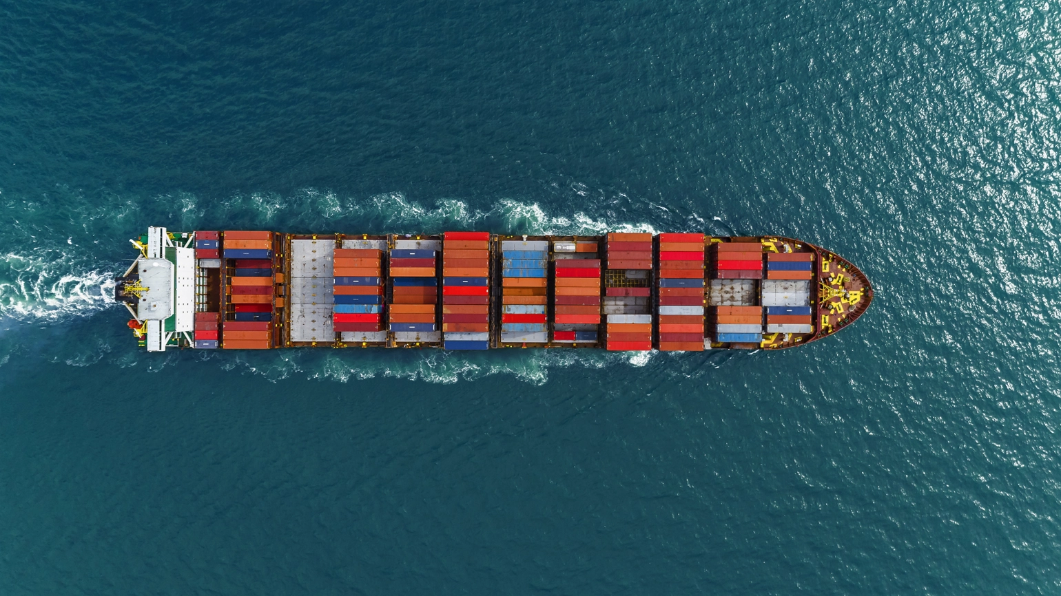 Cargo ship in the ocean in aerial view Cargo ship in the ocean in aerial view