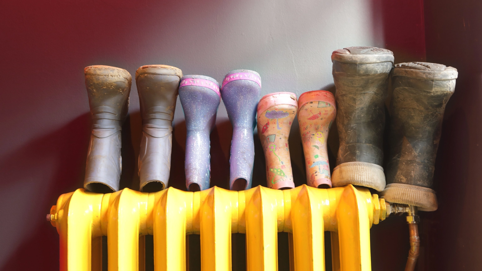 Image of Rows of boots on radiator Image of Rows of boots on radiator