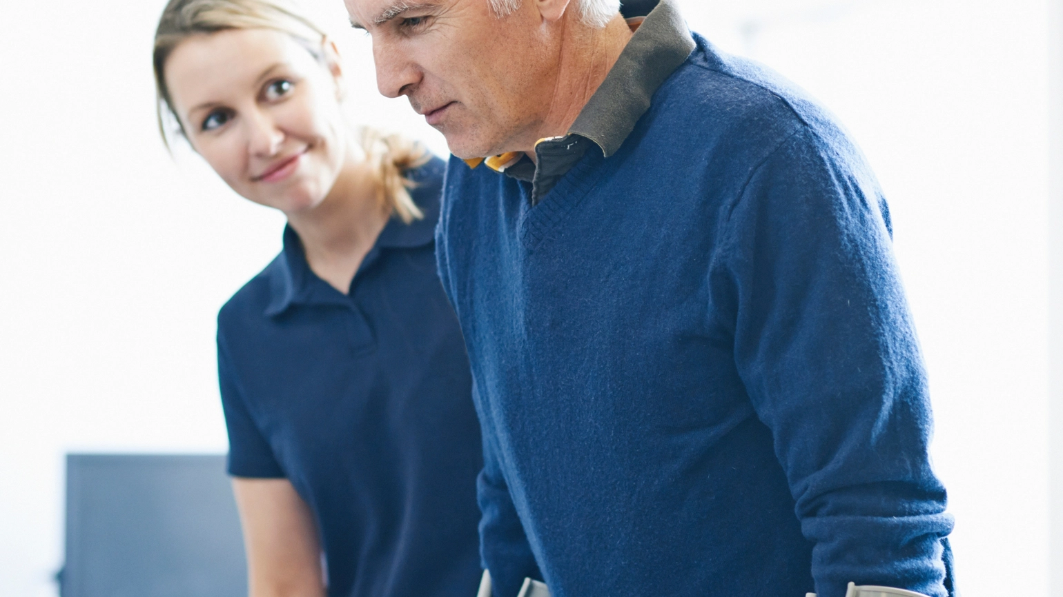 Hospital worker helping their patient  Hospital worker helping their patient