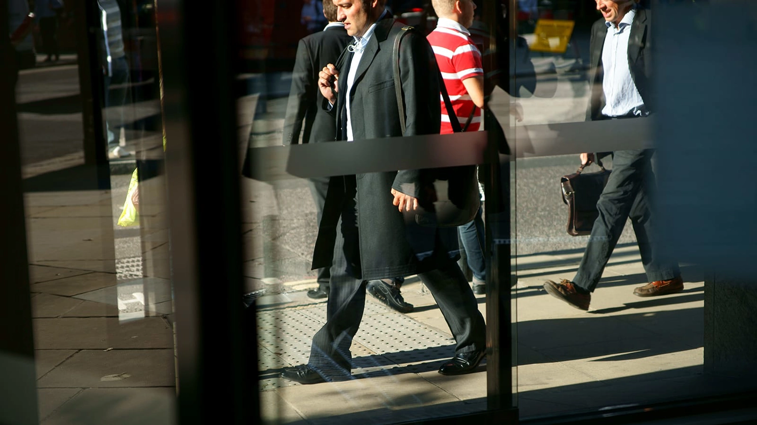 Busy office workers walking down the street Busy office workers walking down the street
