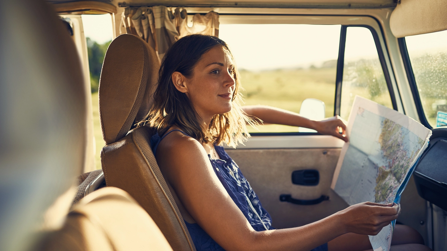 Female checking the map in the van Female checking the map in the van