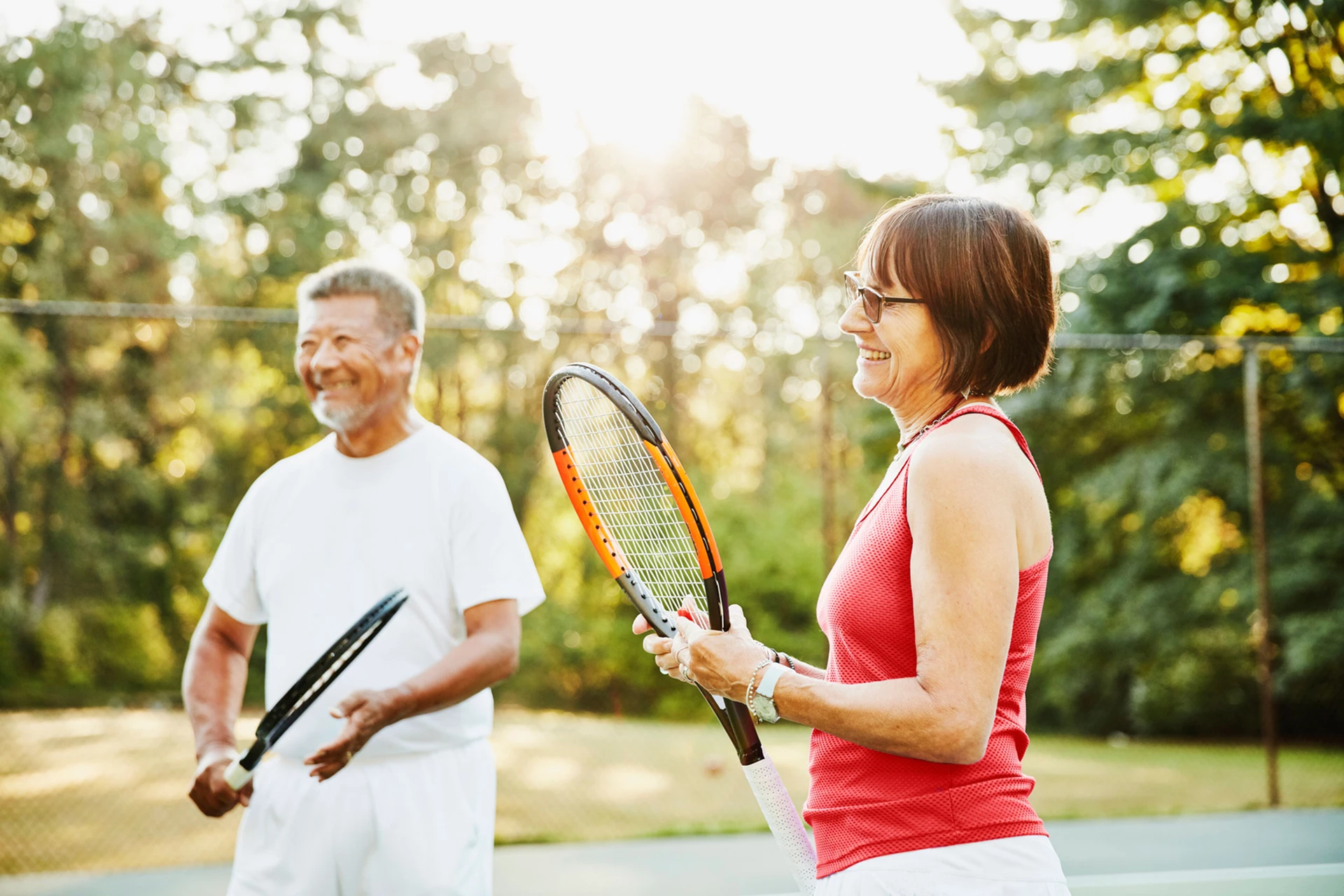 Man and woman playing tennis