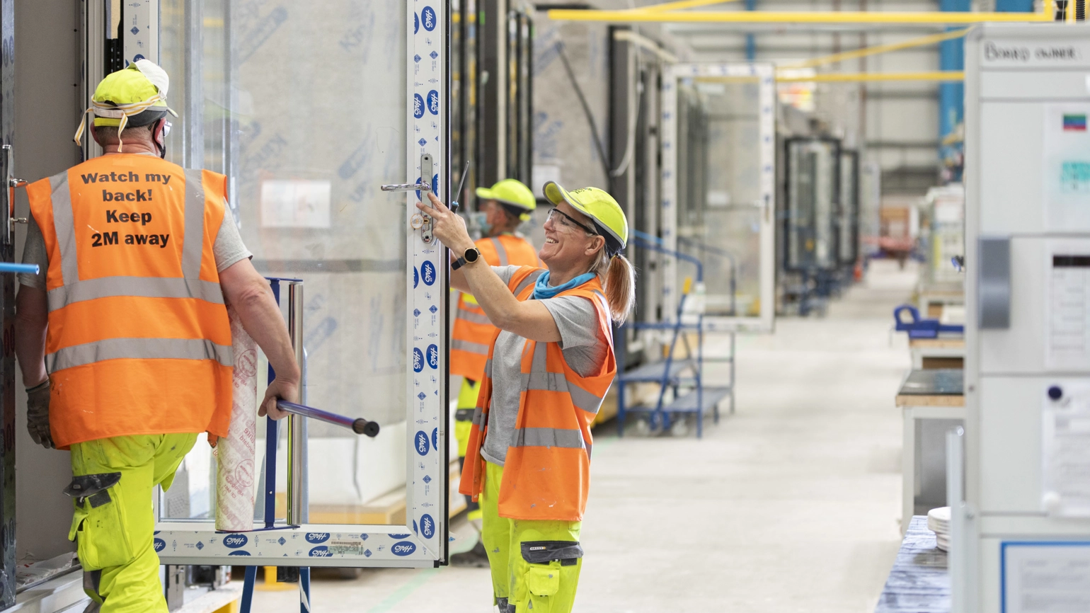 Construction workers building houses Construction workers building houses