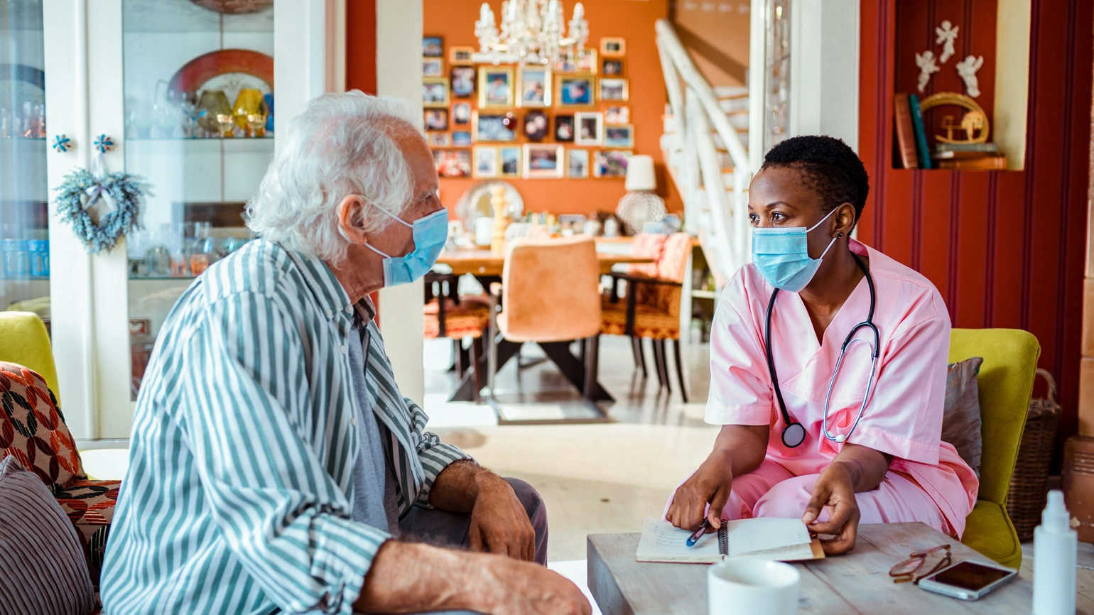 Female doctor checking their elderly patient Female doctor checking their elderly patient