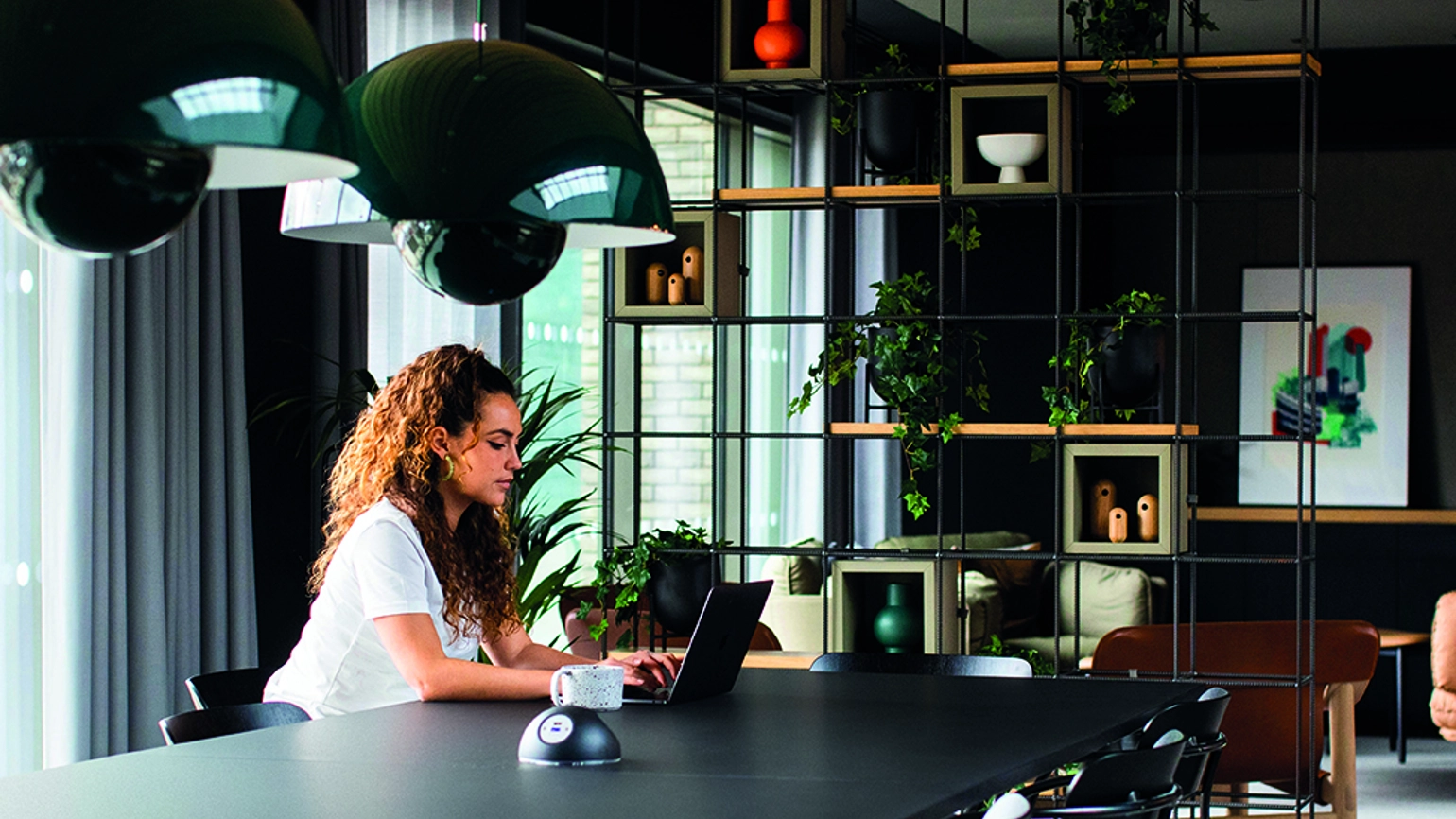 Female checking laptop in working space Female checking laptop in working space