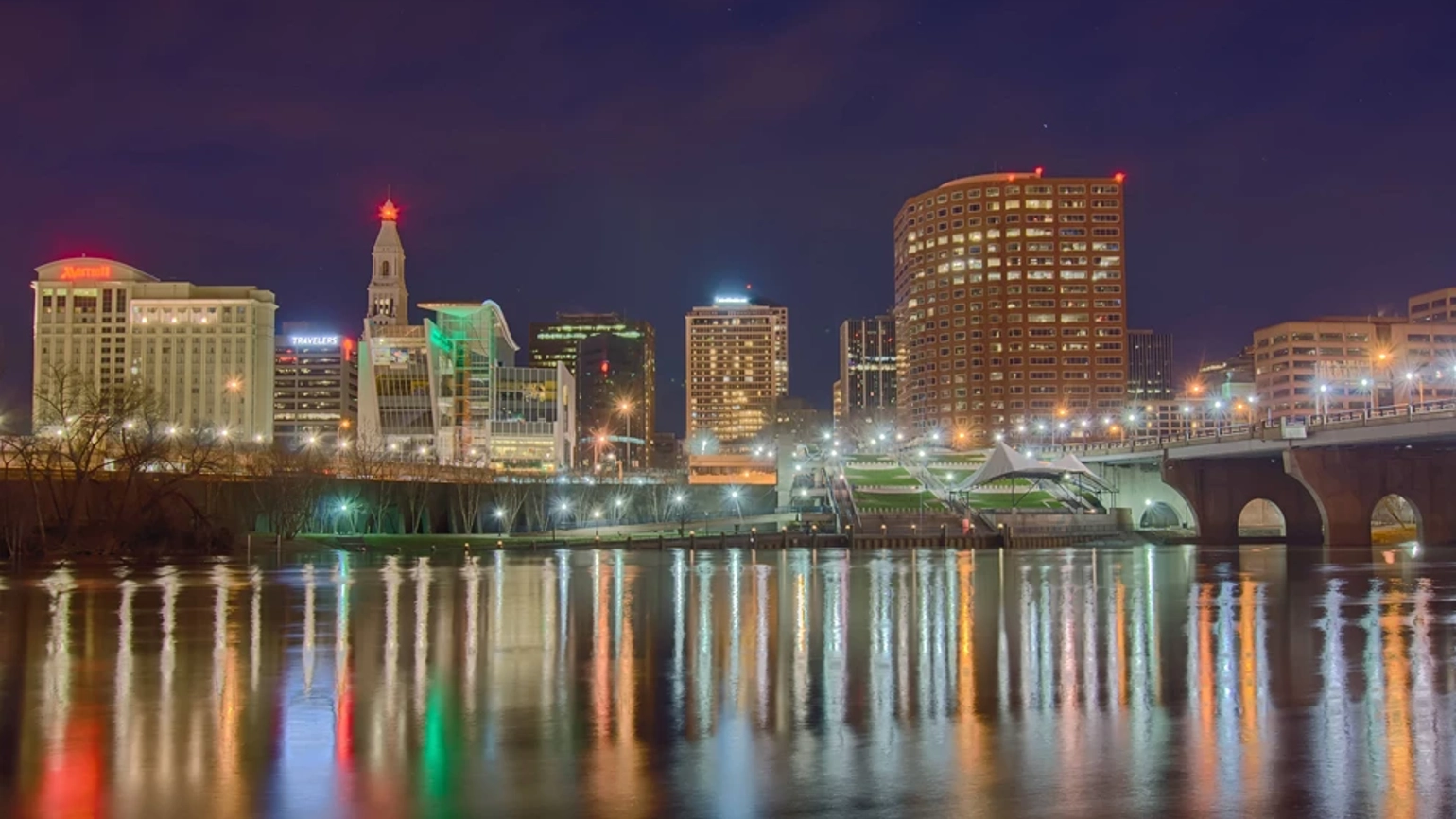 Downtown Hartford Connecticut at dusk from across the Connecticut River. Downtown Hartford Connecticut at dusk from across the Connecticut River.