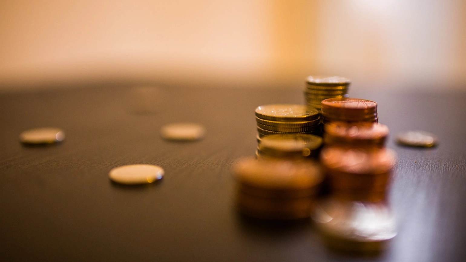 Photo of coins in table  Photo of coins in table