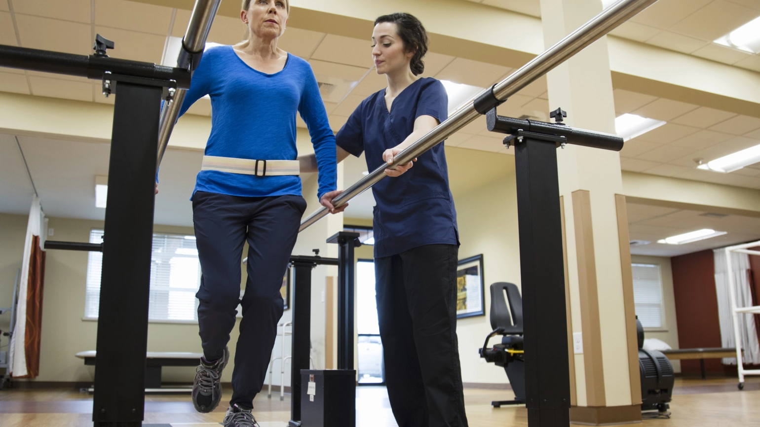 Physical therapist working with their patient Physical therapist working with their patient