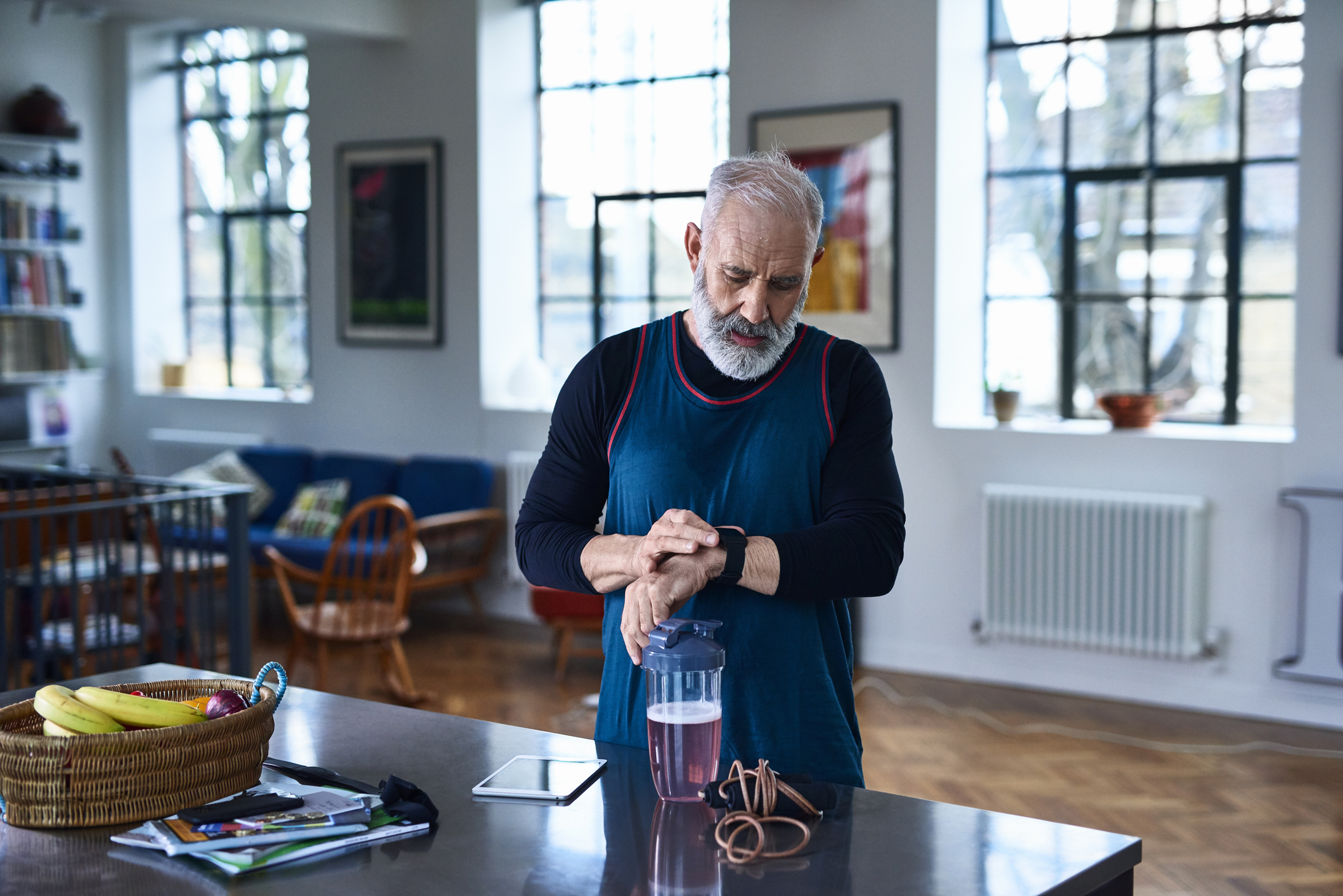 Elderly male checking his sports watch