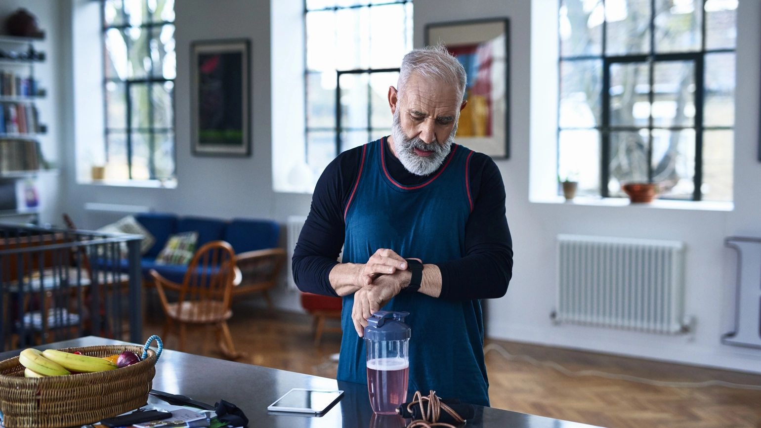 Elderly male checking his sports watch Elderly male checking his sports watch