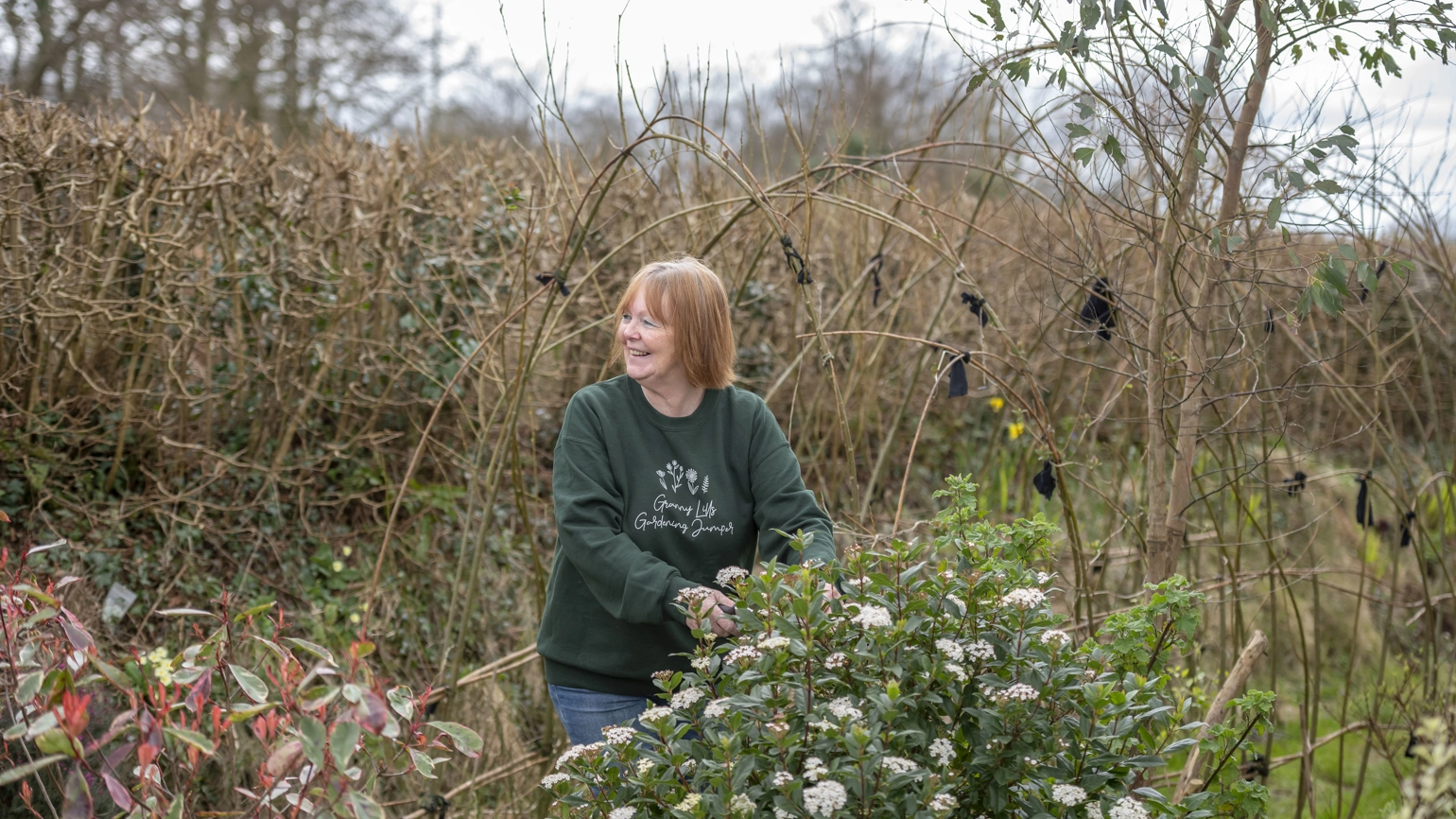 Female gardener working in their garden Female gardener working in their garden