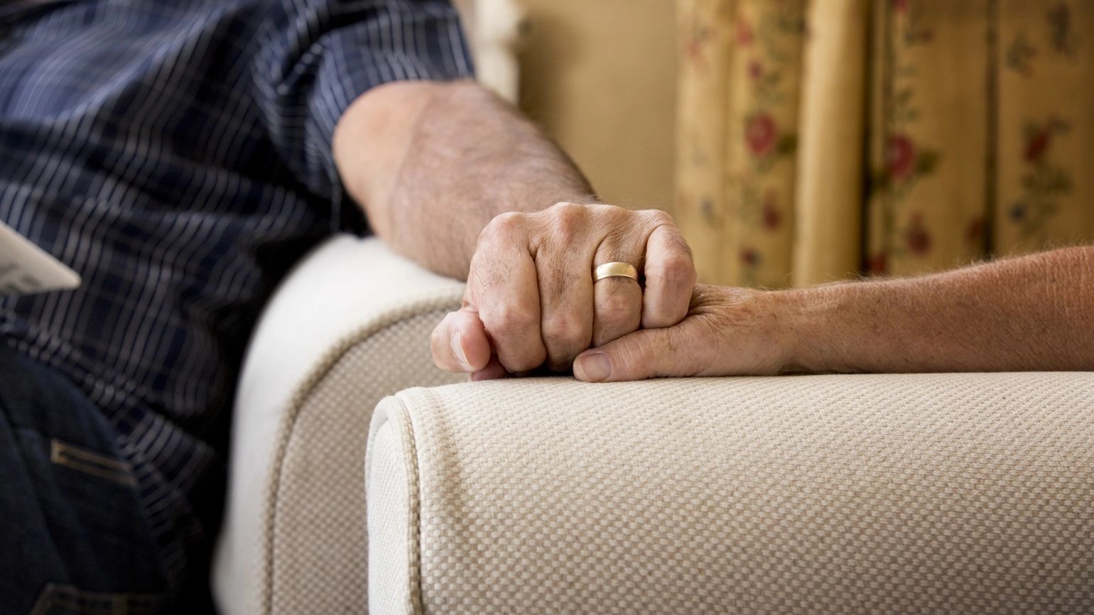 Couple holding their hands together Couple holding their hands together