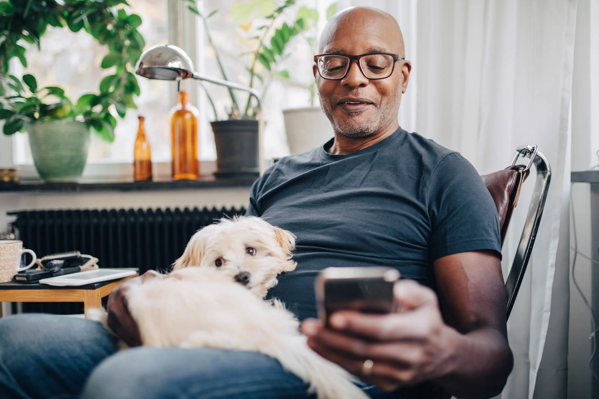 Man with phone and dog