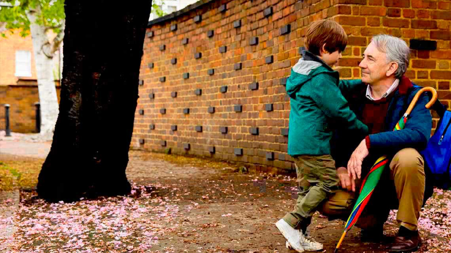 Grandfather and grandson in the street  Grandfather and grandson in the street