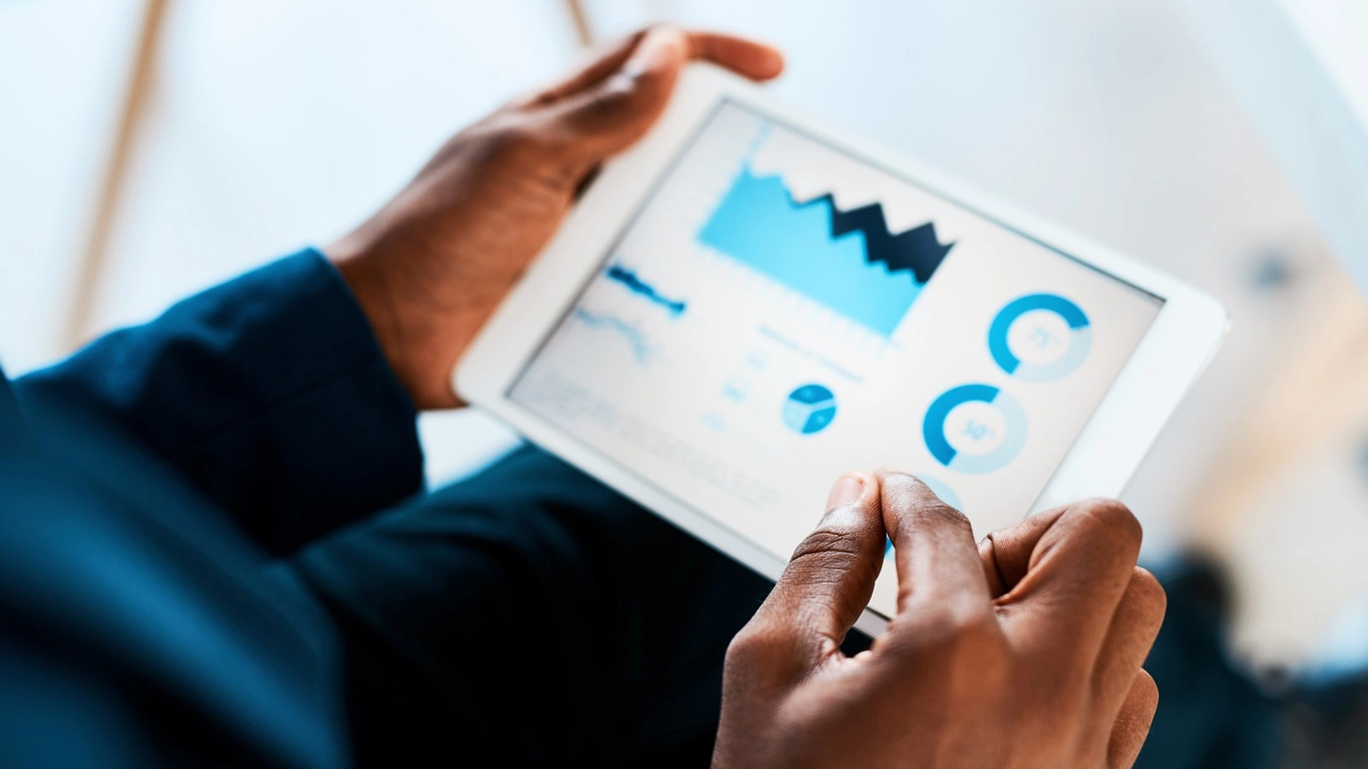 Hand checking charts and numbers in touch screen Hand checking charts and numbers in touch screen