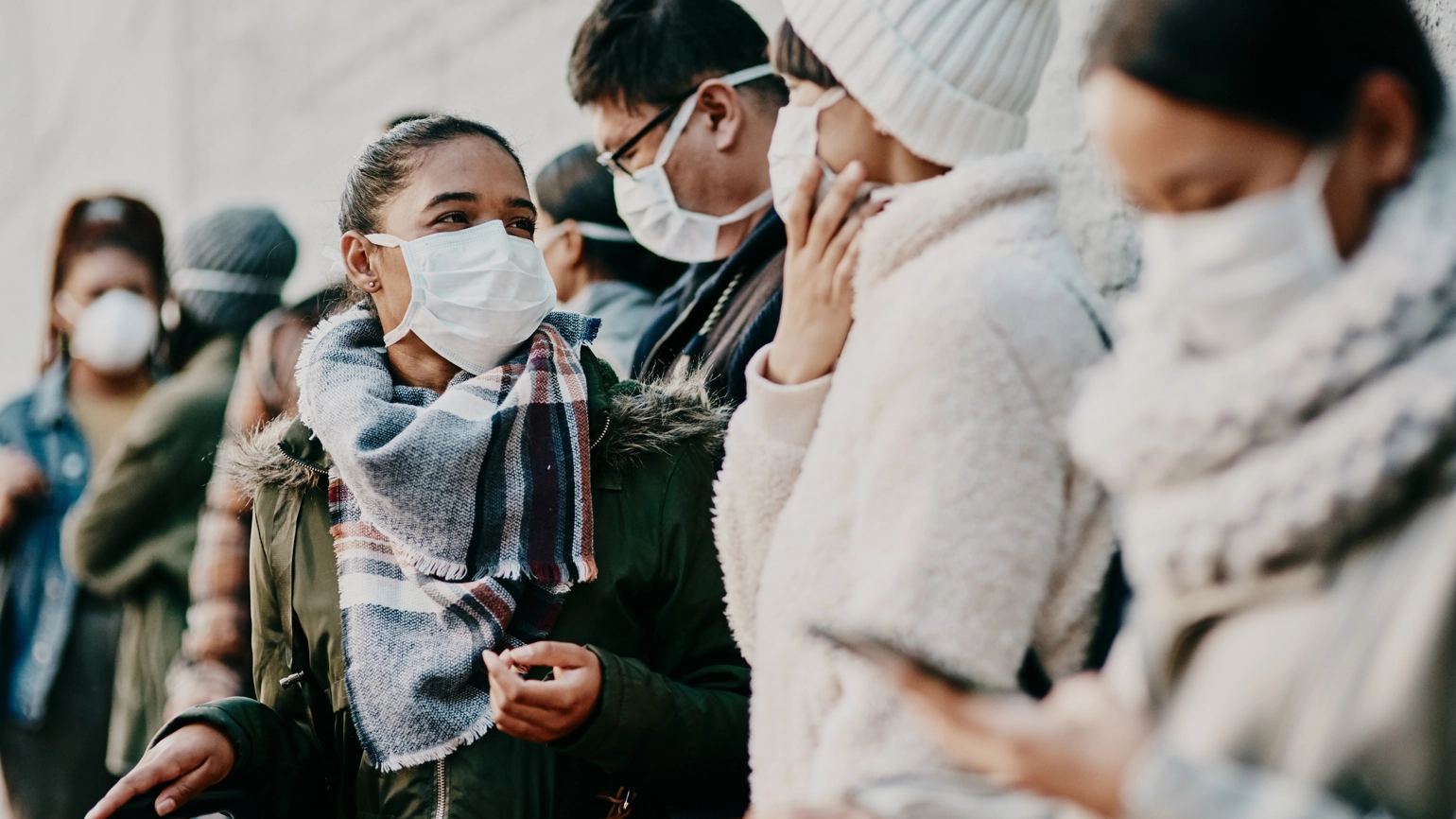 People in queue with their face masks on during covid People in queue with their face masks on during covid