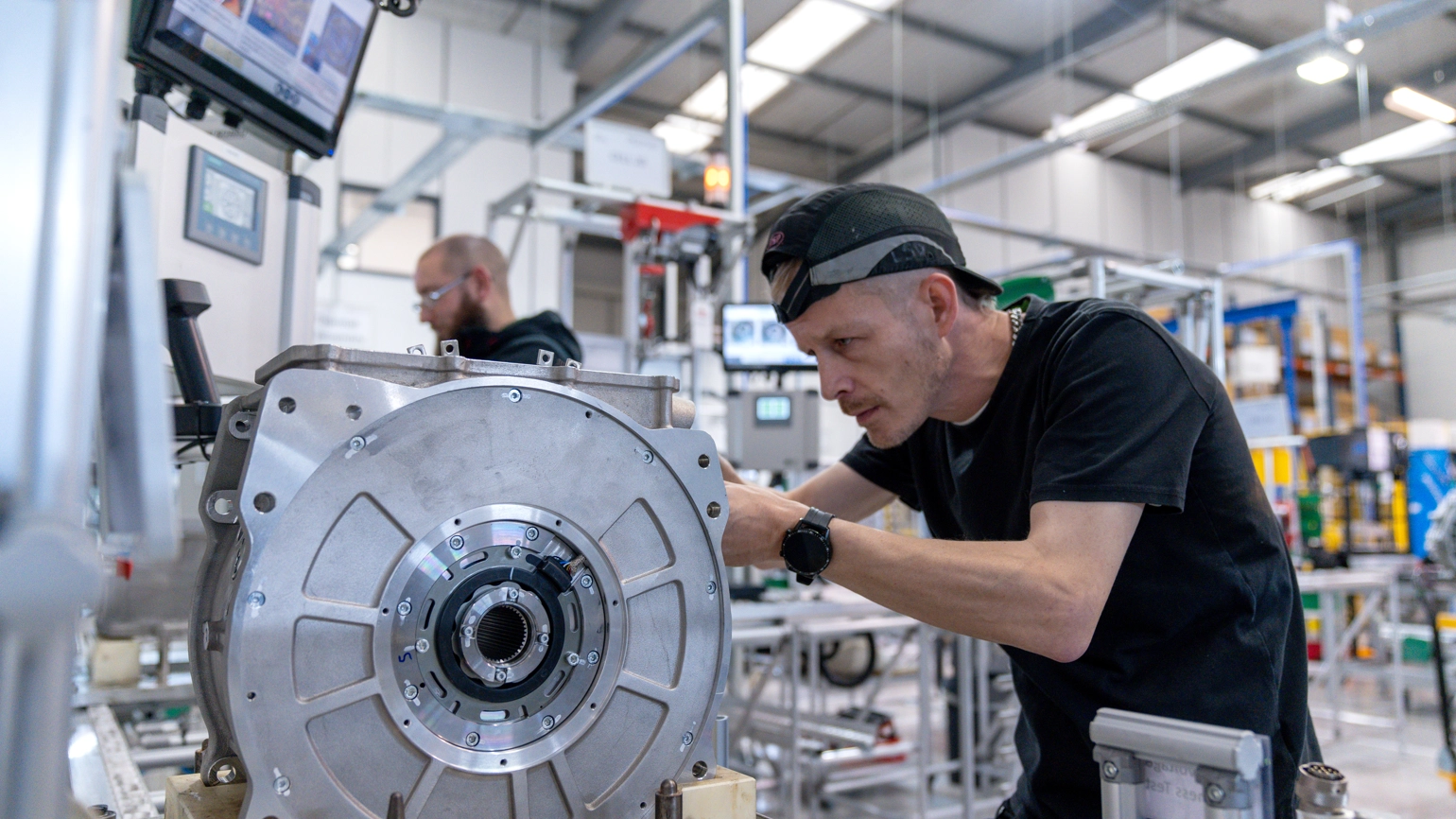Engineer working more machine in the factory Engineer working more machine in the factory