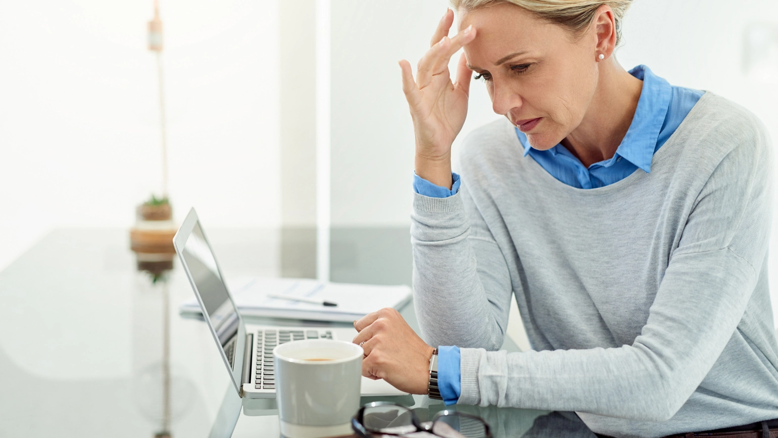 female thinking while checking her laptop female thinking while checking her laptop