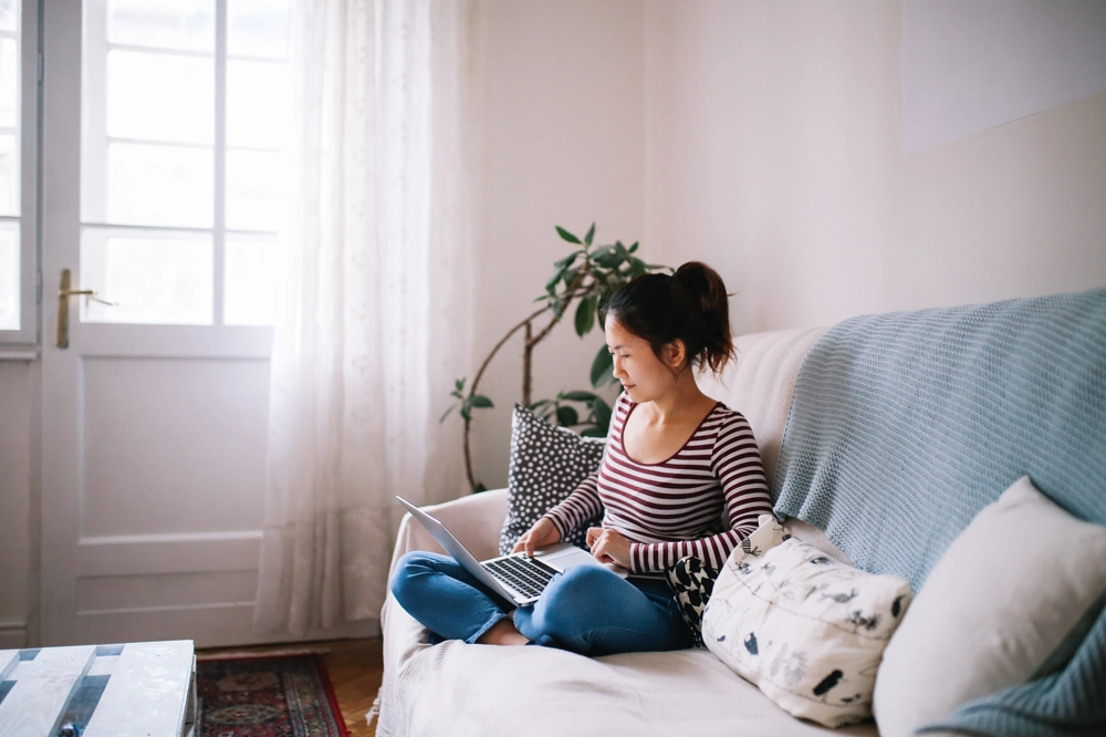 Womanonsofawithlaptop Womanonsofawithlaptop