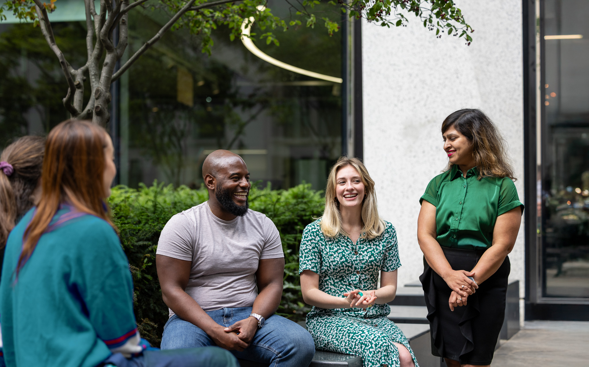 Group of colleagues sitting outside the office