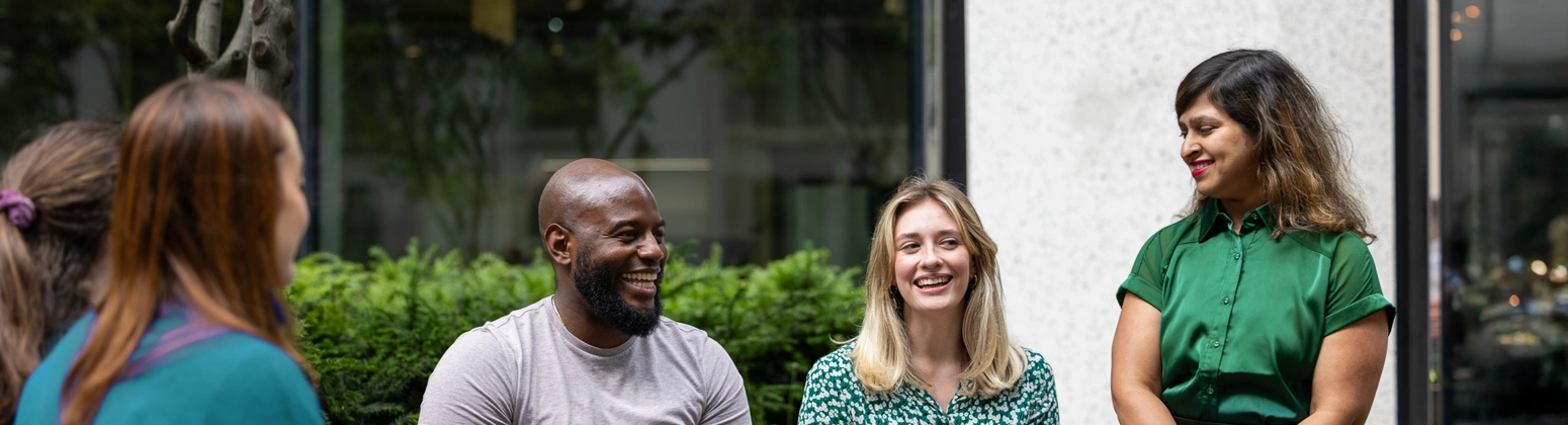 Group of colleagues sitting outside the office Group of colleagues sitting outside the office