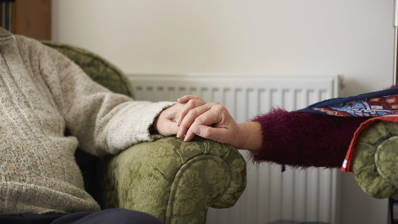 Elderly couple holding their hands Elderly couple holding their hands