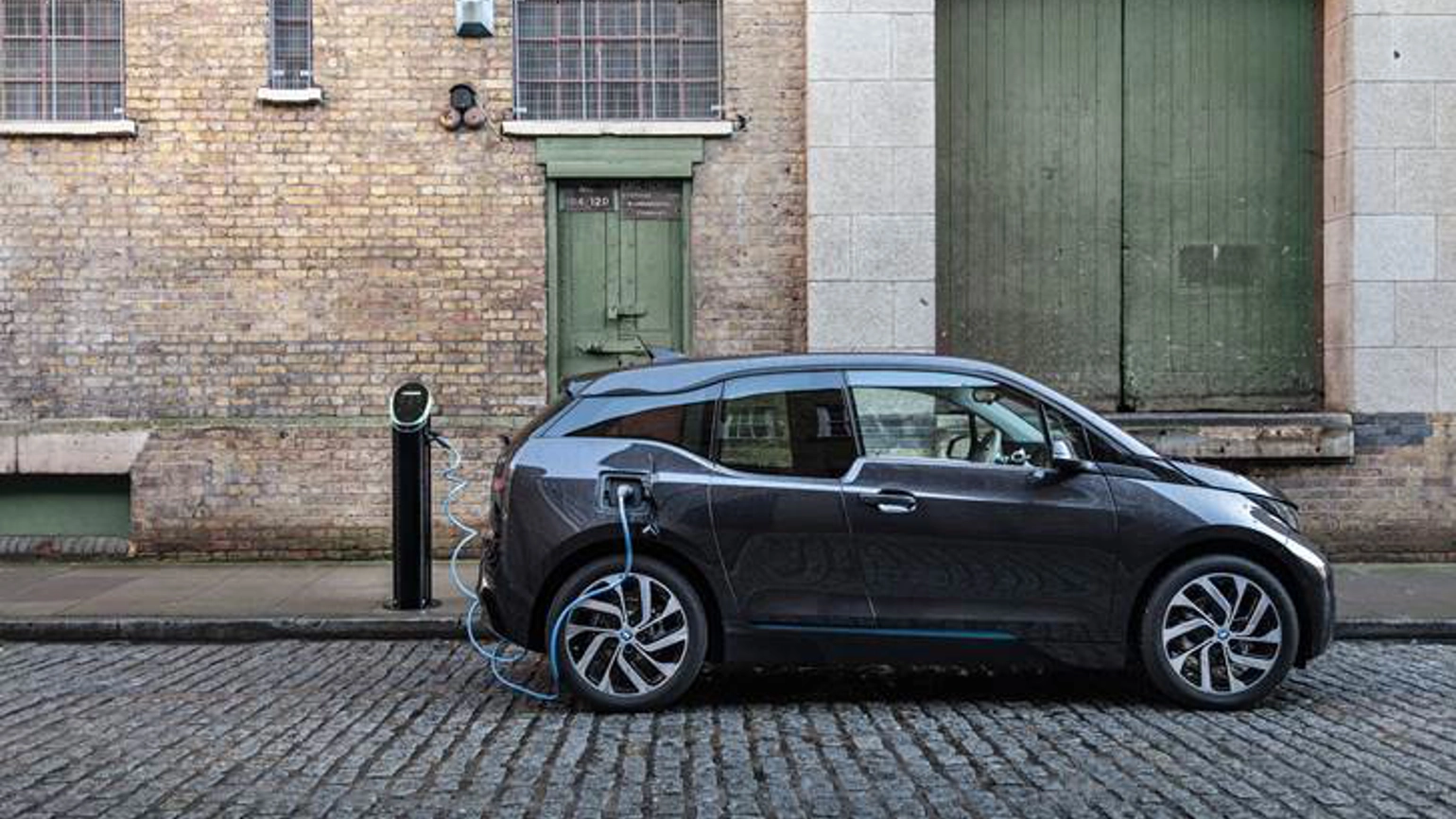 Image of a car in front of Green Door in the street Image of a car in front of Green Door in the street