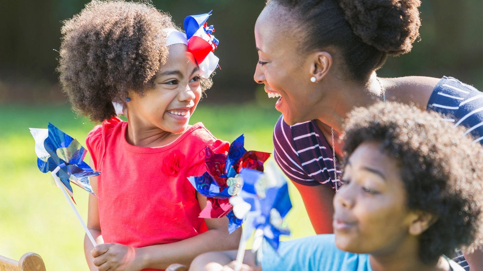 Family smiling with Pinwheel Family smiling with Pinwheel